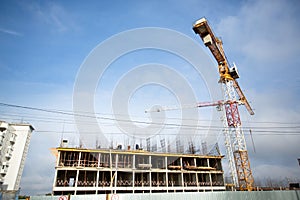 Background of construction site and building with big construction crane and blue sky