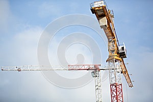 Background of construction site and building with big construction crane and blue sky