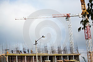 Background of construction site and building with big construction crane and blue sky