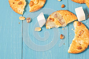 background with cookies with nuts and lump sugar on a blue wooden/background with cookies with nuts and lump sugar on a blue wood