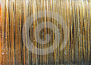 Background of copper wire wound on a coil.