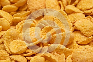 Background of corn flakes close-up. Healthy breakfast