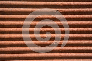 Background of corrugated sheet metal, rusted and worn by the passage of time. Concept background, wallpaper, copy space, metal,