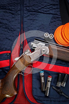 Background for creating a clay skeet shooting poster. Clay target plates for shooting with rifle on wooden background