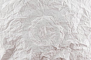 Background from crumpled white paper close-up. Pleated paper