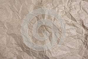 Background of crumpled wrapping paper. Rumpled paper texture