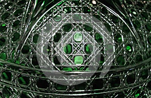 Background from a crystal plafond with faceting and green illumination photo