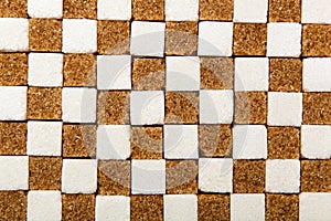 Background of cubes of brown and white sugar