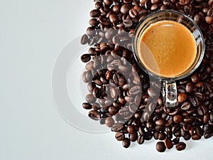 Background of a cup of black coffee with coffee beans