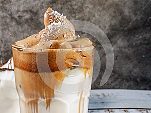 Background of a cup of milk with brown cream photo