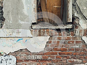 Background of a demolished building... Bricks and windows that are badly damaged...