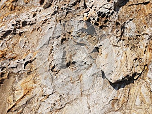 Background design texture of natural stone granite. multi-colored - red, gray