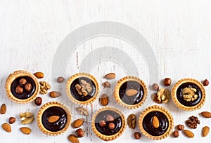 Background desserts Nutty chocolate dessert small tarts