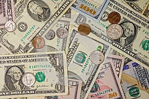 Background of different american dollars bills and coins