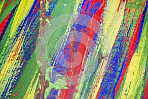 Background from different strokes of red, yellow, green and blue paint