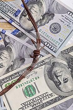 the background of dollars on it is barbed wire. close-up