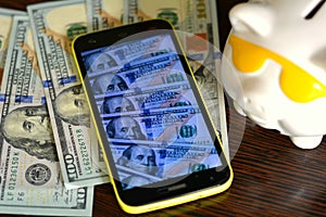 Background dollars money and piggy bank take picture smartphone