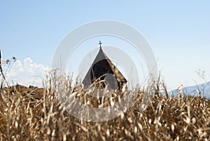 In the background is the Dome of The Island Monastery or Sevanavank (church) in Sevan Island