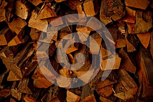 Background of dry chopped logs in a pile