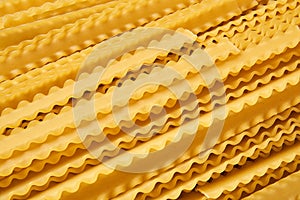 Background of dry mafaldine pasta