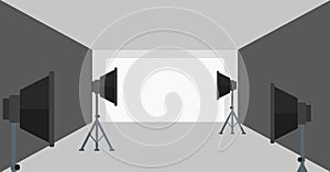 Background of empty photo studio with lighting equipment.