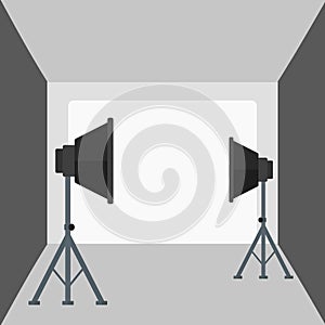 Background of empty photo studio with lighting equipment.