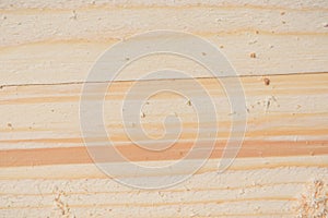 Background ends of the boards. The ends of the lumber. Pine ends. Wood background