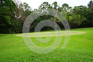 Background of evening golf course has sunlight shining down at golf course in Thailand. Nice scenery on a golf course at a late