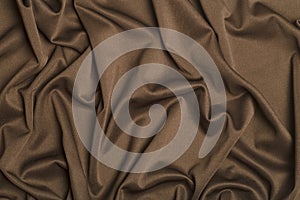 Background fabric. Brown textile fabric with texture and pattern drapery background