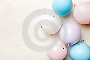 Background with fastive air balloons of round shape and confetti, multicoloured top view. Birthday party background