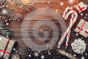 Background. Fir tree, decorative cone. Message space for Christmas and New Year. Sweets and gifts for holidays.