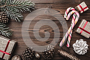 Background. Fir tree, decorative cone. Message space for Christmas and New Year. Sweets and gifts for holidays. colored candies.