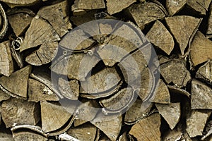 Background of an firewood dry and rough, cut in small pieces.