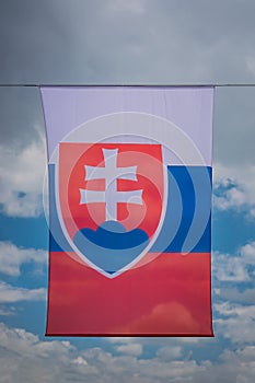 Background from the flag of Slovakia, developing against the sky and clouds