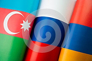 Background of the flags of the azerbaijan, russia, armenia. concept of interaction or counteraction between the countries.