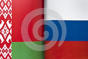 Background of the flags of belarus and russia. The concept of interaction or counteraction between the two countries