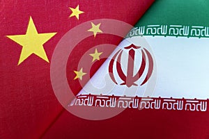 Background of the flags of iran and China. The concept of interaction or counteraction between the two countries