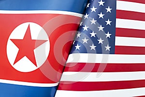 Background of the flags of north korea and USA. The concept of interaction or counteraction between the two countries