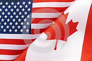 Background of the flags of the USA and canada. The concept of interaction or counteraction between two countries. International