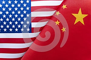 Background of the flags of the USA and China. The concept of interaction or counteraction between two countries