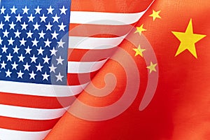 Background of the flags of the USA and china. The concept of interaction or counteraction between two countries. International