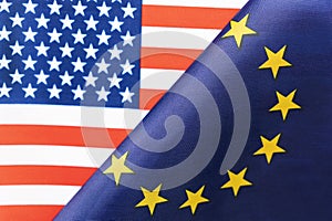 Background of the flags of the USA and European Union. The concept of interaction or counteraction between two countries.