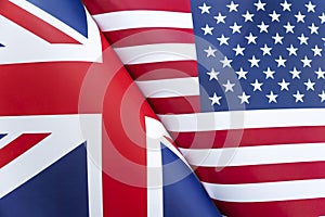 Background of the flags of the USA and Great Britain. The concept of interaction or counteraction between two countries.