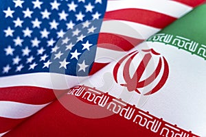 Background of the flags of the USA and iran. The concept of interaction or counteraction between two countries