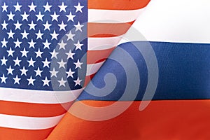 Background of the flags of the USA and russia. The concept of interaction or counteraction between two countries. International