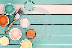 Background of floor boards, paint cans and brush