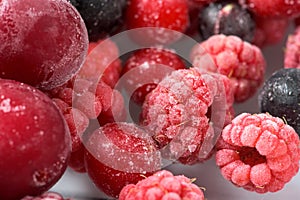 Background of frozen raspberries, fresh berries covered with frost, top view. macro photo close-up