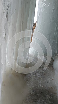 The background of a frozen waterfall, large icicles, the waterfall is located in RSO-Alanya