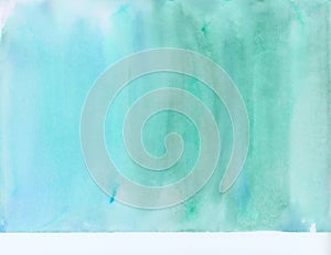 Background fully saturated with watercolor paint in shades of blue and green. Textured watercolor paper.