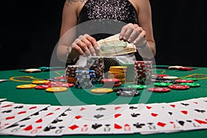 Background of a gaming casino, poker table, cards, chips and a girl with a glass of wine in the background. Background for a